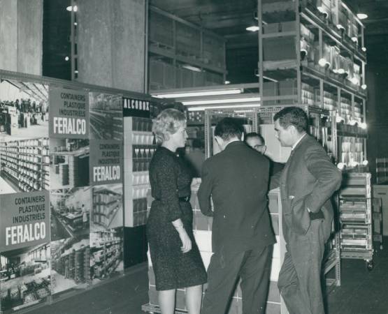 Three people at the 1964 packaging exhibition