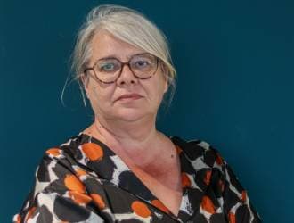 an older woman wearing glasses