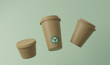 three cardboard containers on a green background
