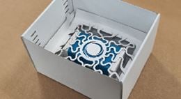 A box with a wedging system at the bottom. 