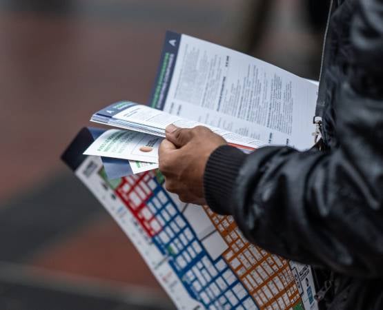 a visitor reading the floor plan at the ALLFORPACK EMBALLAGE PARIS trade fair