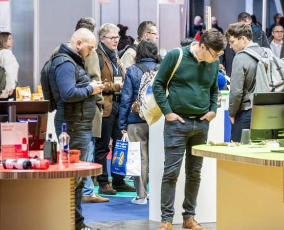 People at a stand at the ALLFORPACK EMBALLAGE PARIS trade fair